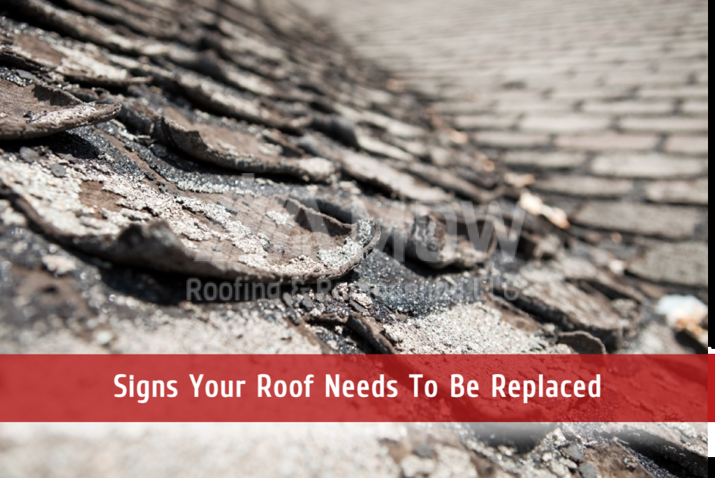 Damaged weathered roof shingles showing signs of deterioration and replacement needs